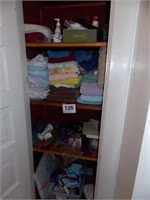 Contents of closet: towels - sheets - fragrance