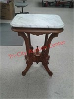 wood end table with marble top top is