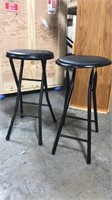 Two collapsible folding stools