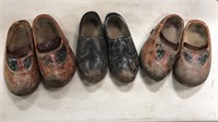 Three pairs of wooden shoes
