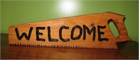 Custom carved welcome saw sign