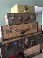4 vintage suitcases