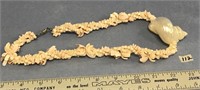 Fabulous 2.5" conch shell and coral bead and cut s
