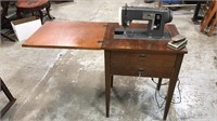 Sewing machine in wood table