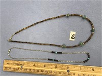 Two southwestern style necklaces. One is Approx. 1