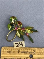 Vintage costume jewelry pin, gold tone and green t