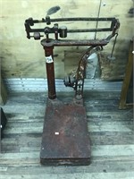 An antique wrought iron floor scale, unknown make