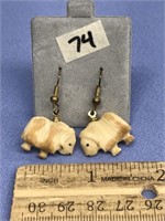 Pair of carved fossilized ivory muskox earrings by