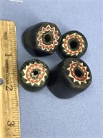 Four old trade beads, two blue and two green