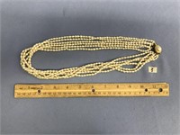 A 6 strand seed pearl necklace, approx. 24" long,