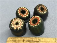 Four old trade beads, two blue and two green