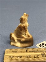 Fossilized ivory carving of a howling wolf by Felb