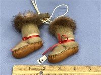 pair of mukluk eskimo yoyos with seal skin fur and