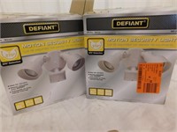 2 Defiant motion security lights, 1 is new in the