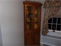 Oak corner cabinet with leaded glass doors