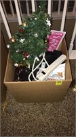 Box of Christmas decorations and outlet strips