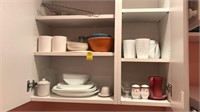 Cabinet full of dishware cups bowls