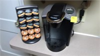 Keurig coffee maker and pod stand like new