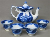 STAFFORDSHIRE FLOW BLUE TEAPOT AND FOUR CUPS