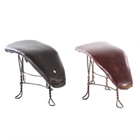 Two wrought iron shoe store stools