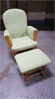 Green upholstered gliding rocking chair