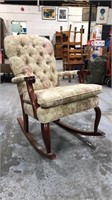 Wood rocking chair with floral upholstery