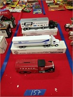 3 Ertl trucks as shown 2 are new in the box
