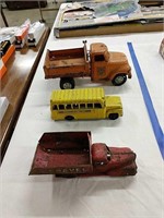 3 vintage tin toy trucks as shown