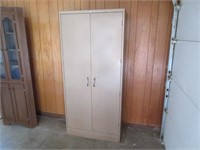 older 2-door metal storage cabinet