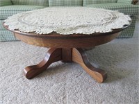 oak 36in round coffee table & doily