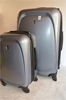 Heys Spinner Suitcases Set of TWO - One Cracked