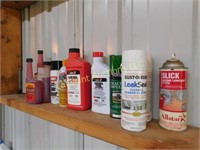 shelf of assorted fuel additives, other