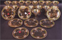 A 24-piece enameled glass set including
