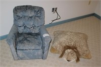 Child's blue recliner with child's pillow