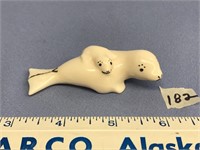 Cow and calf seal 3" long, by J. Kunnook         (