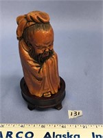 Carved oriental figure from mammoth ivory, 4" tall