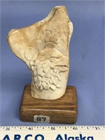 4.5" Bone relief carving of an eagle on wood base