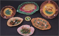 Seven pieces of majolica including plates,