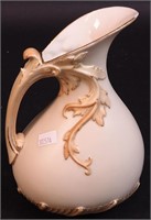 A Royal Worcester ewer with raised foliage,