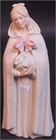 A 10" porcelain Herend figurine of woman in cloak