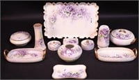 An 10-piece porcelain dresser set decorated