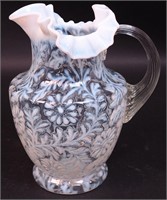 A clear-to-opalescent 10" water pitcher