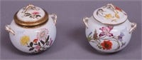 A pair of Royal Worcester covered sugar