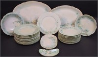 A 61-piece hand-decorated Limoges dinnerware set