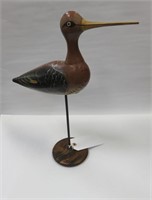 Wooden decoy on stand