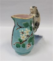 Small majolica pitcher with cat