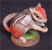 A porcelain ground squirrel figurine