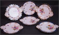 Six two-handled 9" plates decorated with