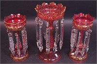 A pair of matching cranberry glass lusters