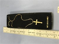 A gold tone crucifix on a 17" chain, cubic zirconi